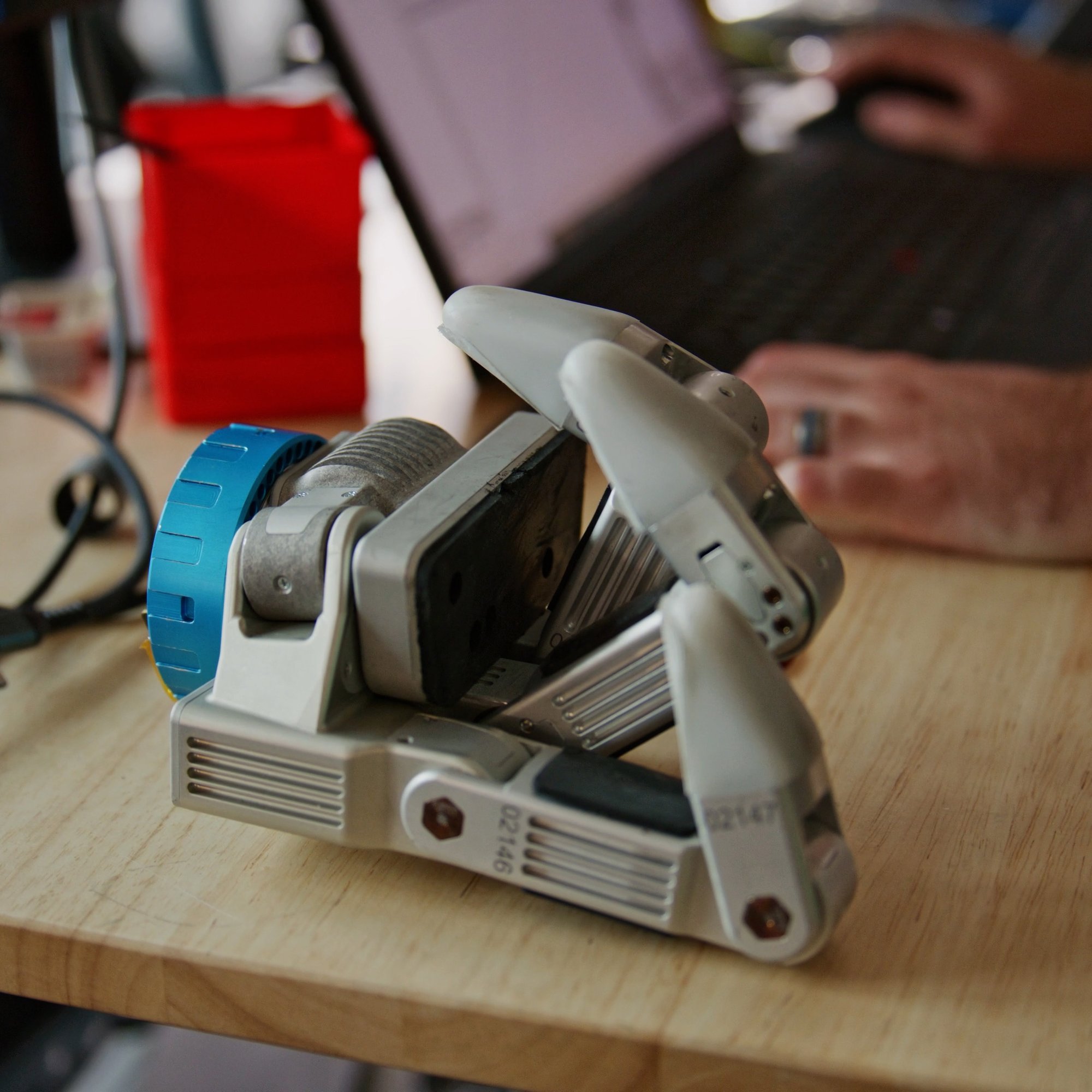 An Atlas gripper on a work bench