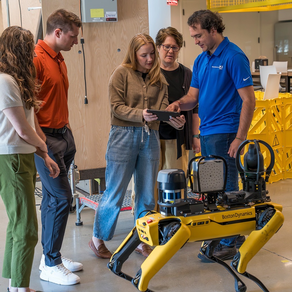 A Boston Dynamics trainer walks learners through operating Spot