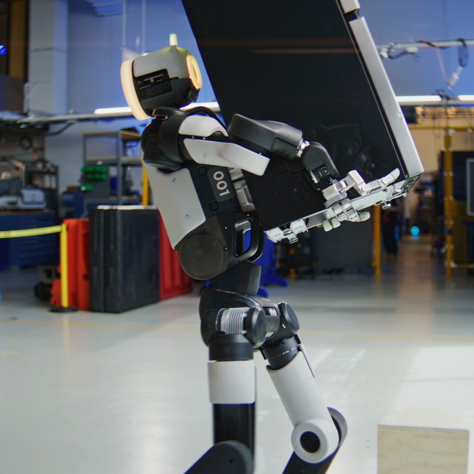 Atlas robot holds a mini-fridge
