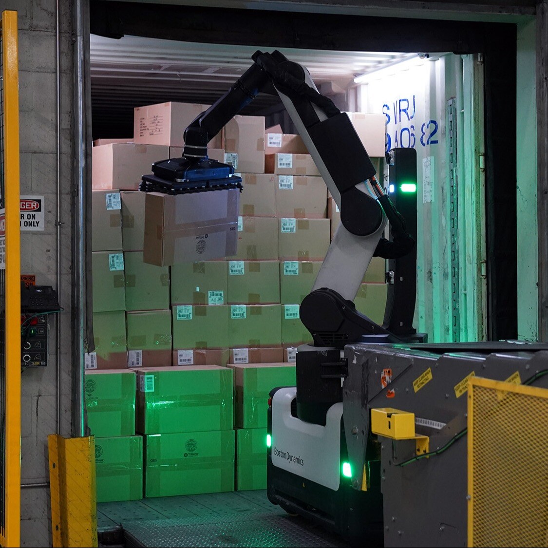 Stretch lifts a package from a trailer