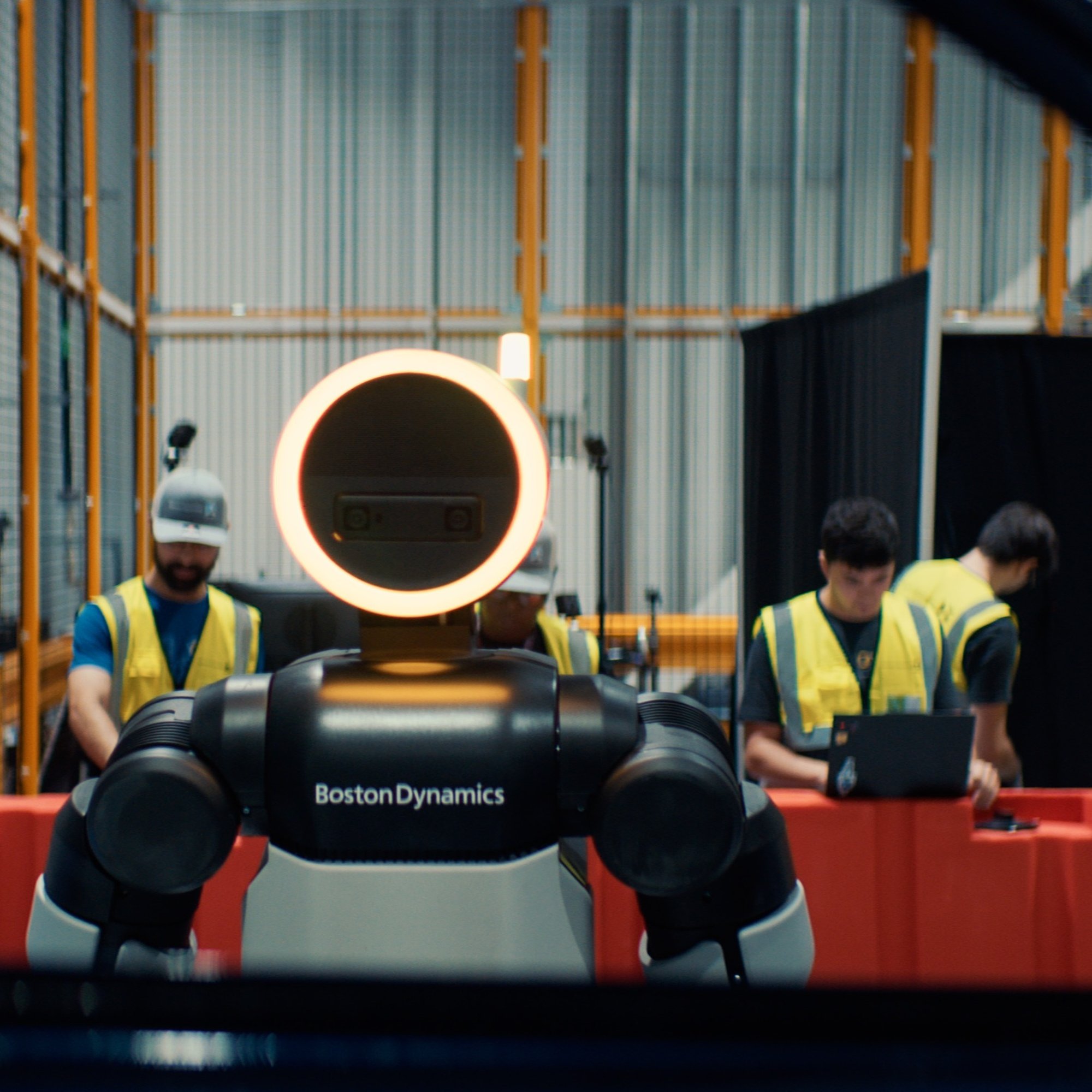 Atlas robot at RMAC training center with technicians in the background